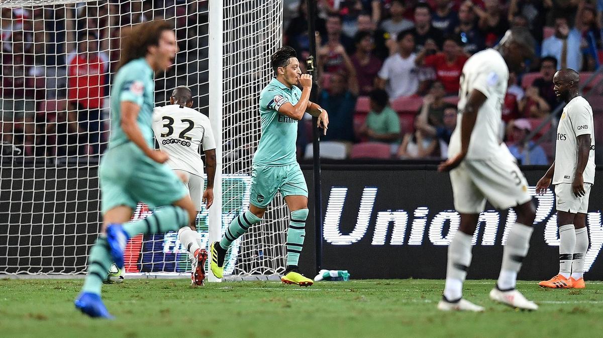 1006659786 Mesut Ozil shines on return as Arsenal crush PSG in Singapore