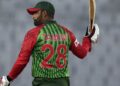 Bangladesh's Tamim Iqbal raises his bat to celebrate scoring fifty runs during the first match of their Tri-Nation one-day international cricket series against Zimbabwe in Dhaka, Bangladesh, Monday, Jan. 15, 2018. (AP Photo/A.M. Ahad)