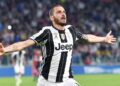 FILE - In this Sunday, April 23, 2017 filer, Juventus' Leonardo Bonucci celebrates after scoring a goal during the Serie A soccer match between Juventus and Genoa at the Juventus stadium in Turin, Italy.Bonucci won six Serie A titles in seven years at Juventus but the Italy defender joined Milan last year _ in what was the shock of the transfer window _ for a fee of more than 40 million euros ($45 million) amid reports of a dressing room spat. Juventus said on Thursday that the 31-year-old Bonucci, who has reportedly taken a pay cut to move back to Juventus, has signed a five-year deal. (Alessandro Di Marco/ANSA via AP)