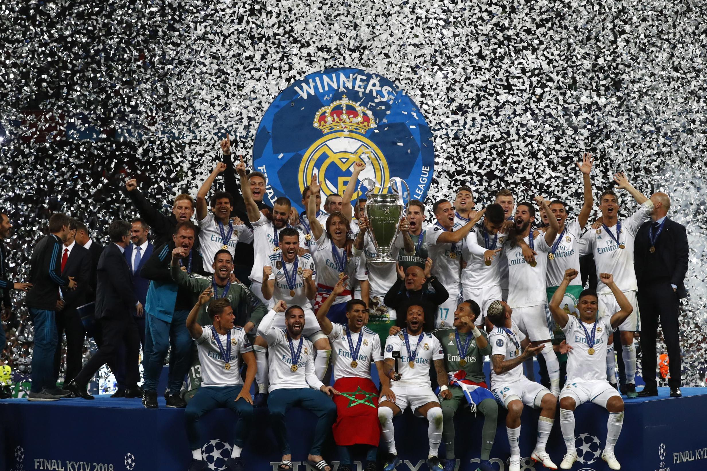 203210969 real madrid players celebrate with trophy after winning the champions league final soccer Manchester City is the favourite to win the 2018-19 UEFA Champions League