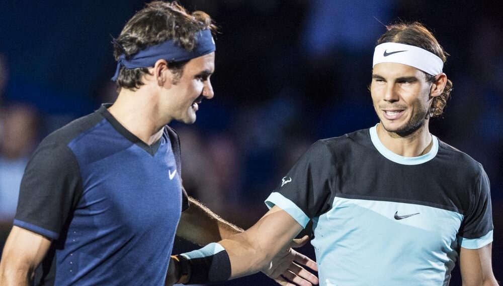Switzerland's Roger Federer, left, and Spain's Rafael Nadal, right, share a word before their final match at the Swiss Indoors tennis tournament at the St. Jakobshalle in Basel, Switzerland, Sunday, Nov. 1, 2015. (Dominic Steinmann/Keystone via AP) ORG XMIT: BAS101