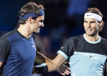 Switzerland's Roger Federer, left, and Spain's Rafael Nadal, right, share a word before their final match at the Swiss Indoors tennis tournament at the St. Jakobshalle in Basel, Switzerland, Sunday, Nov. 1, 2015. (Dominic Steinmann/Keystone via AP) ORG XMIT: BAS101