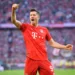 MUNICH, GERMANY - OCTOBER 26: Robert Lewandowski of FC Bayern Munich celebrates after scoring his team's second goal during the Bundesliga match between FC Bayern Muenchen and 1. FC Union Berlin at Allianz Arena on October 26, 2019 in Munich, Germany. (Photo by Sebastian Widmann/Bongarts/Getty Images)