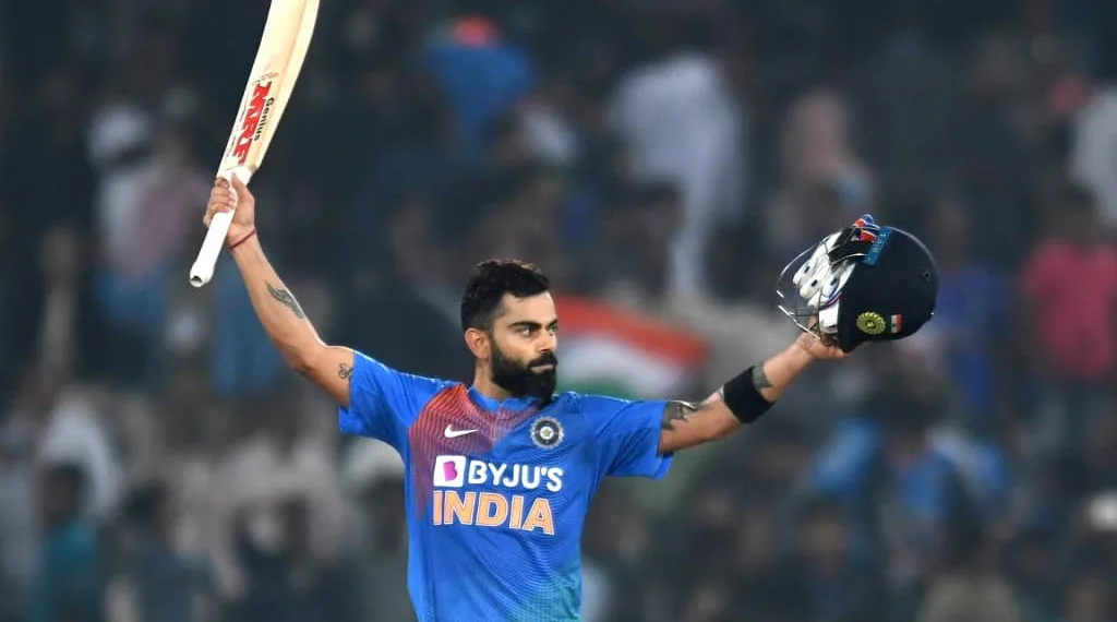 Indian cricket captain Virat Kohli raise his bat after winning the match against West Indies during the first T20 international cricket match of a three-match series between India and West Indies at the Rajiv Gandhi International Cricket Stadium in Hyderabad on December 6, 2019. (Photo by NOAH SEELAM / AFP) / ----IMAGE RESTRICTED TO EDITORIAL USE - STRICTLY NO COMMERCIAL USE-----