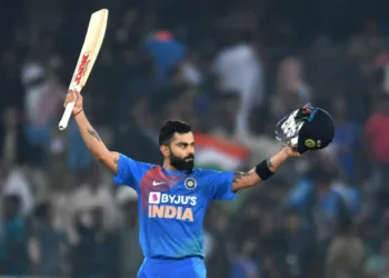 Indian cricket captain Virat Kohli raise his bat after winning the match against West Indies during the first T20 international cricket match of a three-match series between India and West Indies at the Rajiv Gandhi International Cricket Stadium in Hyderabad on December 6, 2019. (Photo by NOAH SEELAM / AFP) / ----IMAGE RESTRICTED TO EDITORIAL USE - STRICTLY NO COMMERCIAL USE-----