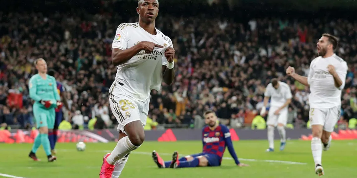 MADRID, SPAIN - MARCH 01: Vinicius Junior of Real Madrid celebrates after scoring his team's first goal during the Liga match between Real Madrid CF and FC Barcelona at Estadio Santiago Bernabeu on March 01, 2020 in Madrid, Spain. (Photo by Gonzalo Arroyo Moreno/Getty Images)