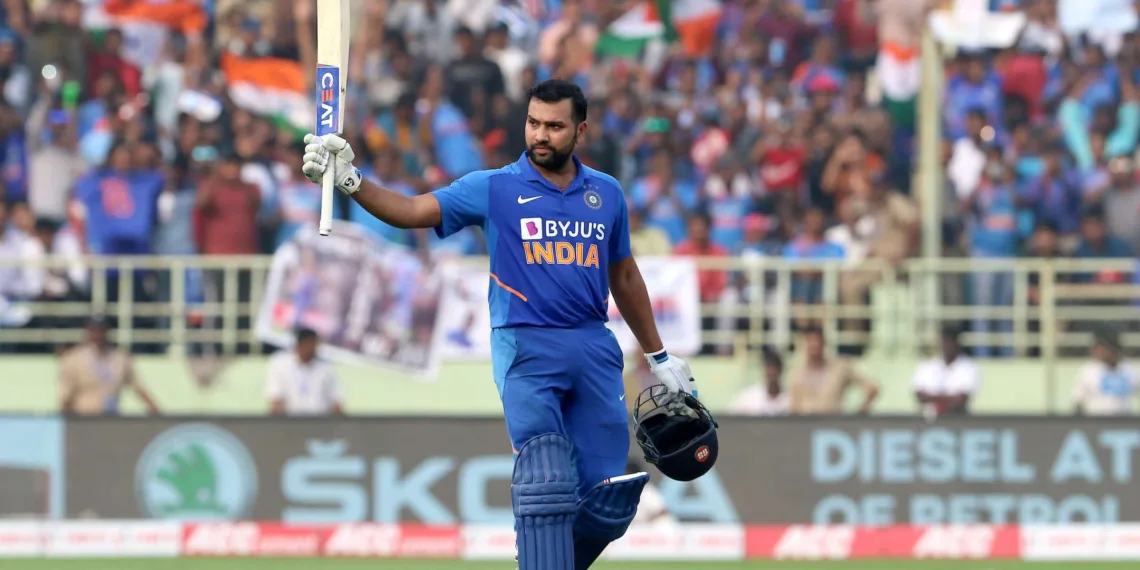 Rohit Sharma of India raises his bat after scoring a hundred during the 2nd ODI between India and the West Indies held at the ACA-VDCA Stadium, Visakhapatnam on the 18th December 2019.Photo by Vipin Pawar / Sportzpics for BCCI