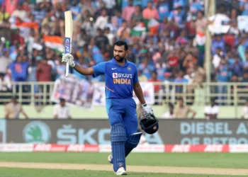 Rohit Sharma of India raises his bat after scoring a hundred during the 2nd ODI between India and the West Indies held at the  ACA-VDCA Stadium, Visakhapatnam on the 18th December 2019.Photo by Vipin Pawar / Sportzpics for BCCI