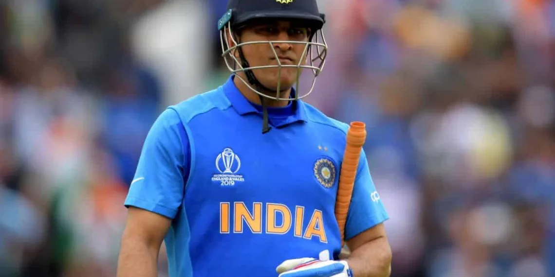 India's Mahendra Singh Dhoni walks off for 50 during the 2019 Cricket World Cup first semi-final between New Zealand and India at Old Trafford in Manchester, northwest England, on July 10, 2019. (Photo by Dibyangshu Sarkar / AFP) / RESTRICTED TO EDITORIAL USE
