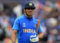 India's Mahendra Singh Dhoni walks off for 50 during the 2019 Cricket World Cup first semi-final between New Zealand and India at Old Trafford in Manchester, northwest England, on July 10, 2019. (Photo by Dibyangshu Sarkar / AFP) / RESTRICTED TO EDITORIAL USE