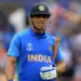 India's Mahendra Singh Dhoni walks off for 50 during the 2019 Cricket World Cup first semi-final between New Zealand and India at Old Trafford in Manchester, northwest England, on July 10, 2019. (Photo by Dibyangshu Sarkar / AFP) / RESTRICTED TO EDITORIAL USE