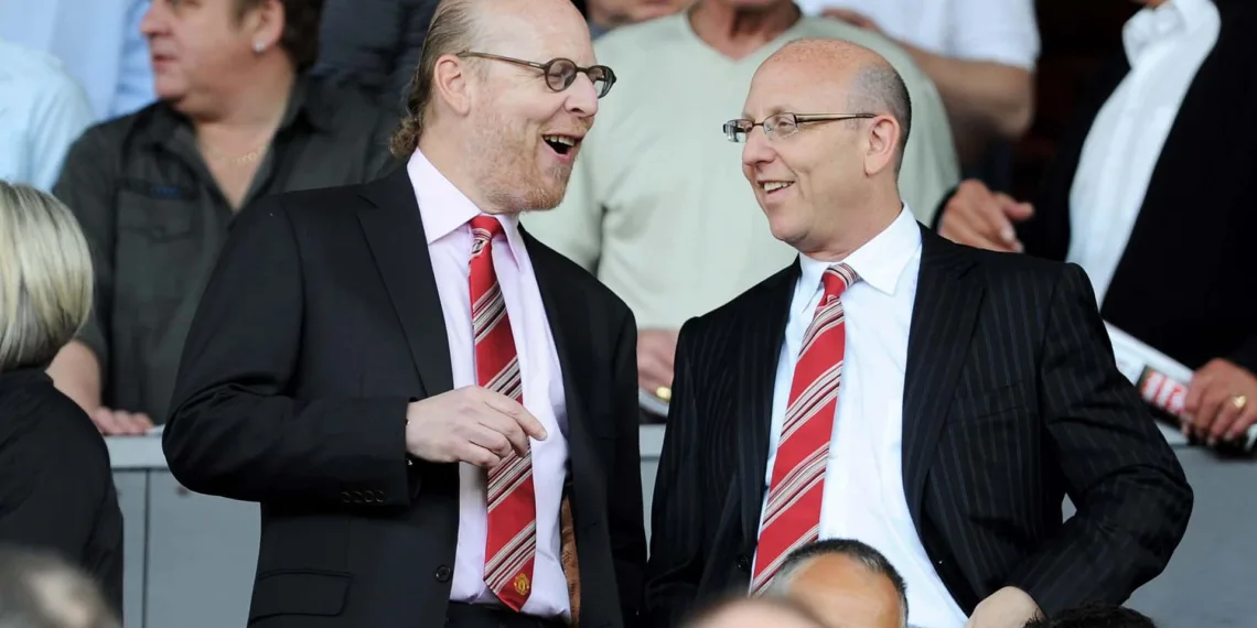 MANCHESTER, ENGLAND - APRIL 09: Manchester United Co-Chairmen Joel Glazer (R) and Avram Glazer talk during the Barclays Premier League match between Manchester United and Fulham at Old Trafford on April 9, 2011 in Manchester, England.  (Photo by Michael Regan/Getty Images)