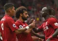 Liverpool's Senegalese striker Sadio Mané (R) celebrates with teammates after scoring their third goal during the English Premier League football match between Liverpool and West Ham United at Anfield in Liverpool, north west England on August 12, 2018. (Photo by Oli SCARFF / AFP) / RESTRICTED TO EDITORIAL USE. No use with unauthorized audio, video, data, fixture lists, club/league logos or 'live' services. Online in-match use limited to 120 images. An additional 40 images may be used in extra time. No video emulation. Social media in-match use limited to 120 images. An additional 40 images may be used in extra time. No use in betting publications, games or single club/league/player publications. /         (Photo credit should read OLI SCARFF/AFP/Getty Images)