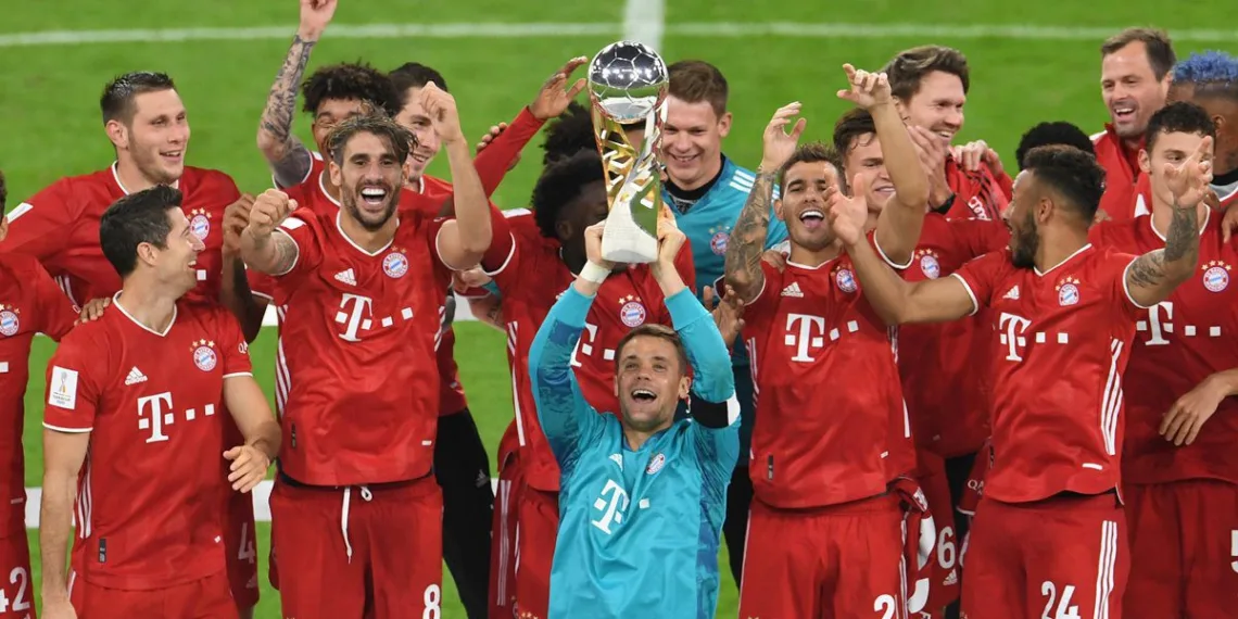 Soccer Football - DFL-Supercup - Bayern Munich v Borussia Dortmund - Allianz Arena, Munich, Germany - September 30, 2020 Bayern Munich's Manuel Neuer and teammates celebrate with the trophy after winning the Supercup REUTERS/Andreas Gebert/Pool