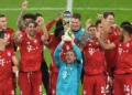 Soccer Football - DFL-Supercup - Bayern Munich v Borussia Dortmund - Allianz Arena, Munich, Germany - September 30, 2020  Bayern Munich's Manuel Neuer and teammates celebrate with the trophy after winning the Supercup   REUTERS/Andreas Gebert/Pool