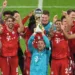 Soccer Football - DFL-Supercup - Bayern Munich v Borussia Dortmund - Allianz Arena, Munich, Germany - September 30, 2020  Bayern Munich's Manuel Neuer and teammates celebrate with the trophy after winning the Supercup   REUTERS/Andreas Gebert/Pool