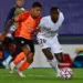 Real Madrid's Brazilian forward Vinicius Junior challenges Shakhtar Donetsk's Brazilian midfielder Dodo (L) during the UEFA Champions League group B football match between Real Madrid and Shakhtar Donetsk at the Alfredo di Stefano stadium in Valdebebas on the outskirts of Madrid on October 21, 2020. (Photo by GABRIEL BOUYS / AFP)