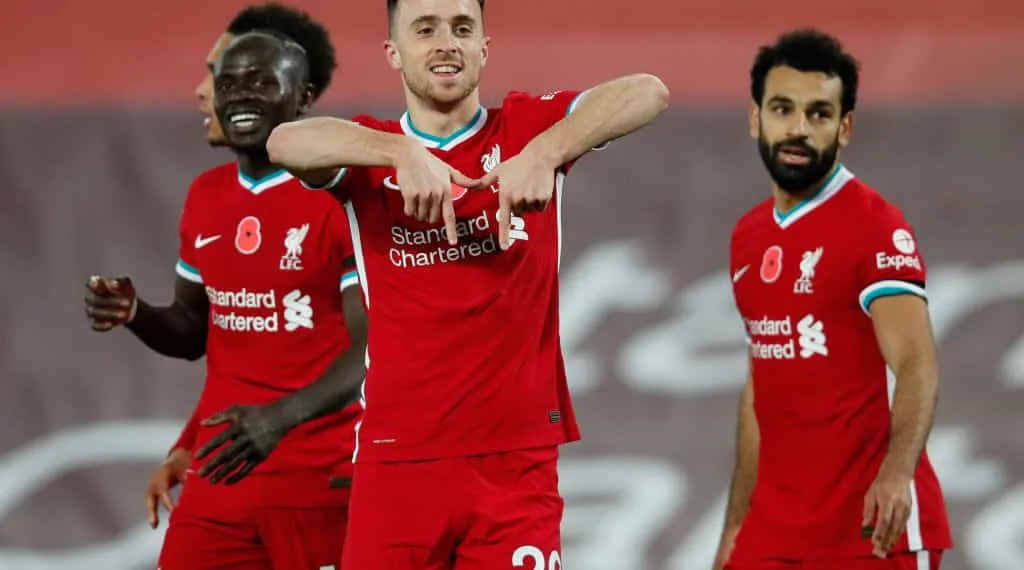 LIVERPOOL, ENGLAND - OCTOBER 31: Diogo Jota of Liverpool  celebrates after he scores his team's second goal  during the Premier League match between Liverpool and West Ham United at Anfield on October 31, 2020 in Liverpool, England. Sporting stadiums around the UK remain under strict restrictions due to the Coronavirus Pandemic as Government social distancing laws prohibit fans inside venues resulting in games being played behind closed doors. (Photo by Clive Brunskill/Getty Images)