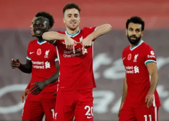 LIVERPOOL, ENGLAND - OCTOBER 31: Diogo Jota of Liverpool  celebrates after he scores his team's second goal  during the Premier League match between Liverpool and West Ham United at Anfield on October 31, 2020 in Liverpool, England. Sporting stadiums around the UK remain under strict restrictions due to the Coronavirus Pandemic as Government social distancing laws prohibit fans inside venues resulting in games being played behind closed doors. (Photo by Clive Brunskill/Getty Images)