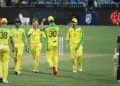 Australian players celebrate the wicket of Indian batsmen.