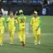 Australian players celebrate the wicket of Indian batsmen.