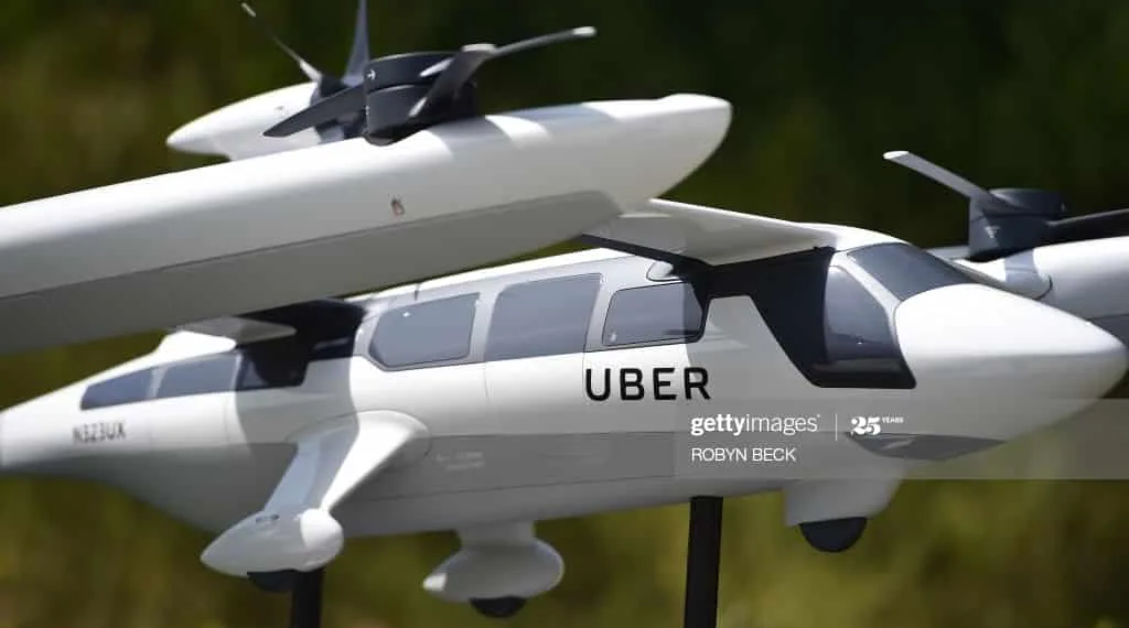 A model of Uber's electric vertical take-off  and  landing vehicle concept (eVTOL) flying taxi is displayed at the second annual Uber Elevate Summit, on May 8, 2018 at the Skirball Center in Los Angeles, California. - Uber introduced it's electric powered "flying taxi" vertical take-off and landing concept aircraft at the event, which showcases prototypes for UberAir's fleet of airborne taxis. (Photo by Robyn Beck / AFP)        (Photo credit should read ROBYN BECK/AFP via Getty Images)