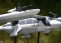 A model of Uber's electric vertical take-off  and  landing vehicle concept (eVTOL) flying taxi is displayed at the second annual Uber Elevate Summit, on May 8, 2018 at the Skirball Center in Los Angeles, California. - Uber introduced it's electric powered "flying taxi" vertical take-off and landing concept aircraft at the event, which showcases prototypes for UberAir's fleet of airborne taxis. (Photo by Robyn Beck / AFP)        (Photo credit should read ROBYN BECK/AFP via Getty Images)