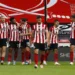 SHEFFIELD, ENGLAND - JULY 02: Lys Mousset of Sheffield United celebrates with Oliver McBurnie and Jack Robinson after scoring his team's second goal during the Premier League match between Sheffield United and Tottenham Hotspur at Bramall Lane on July 02, 2020 in Sheffield, England. Football Stadiums around Europe remain empty due to the Coronavirus Pandemic as Government social distancing laws prohibit fans inside venues resulting in all fixtures being played behind closed doors. (Photo by Jason Cairnduff/Pool via Getty Images)