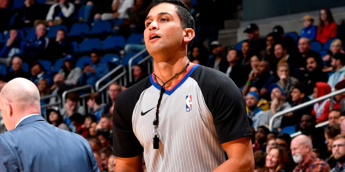 Suyash Mehta officiating during a match.