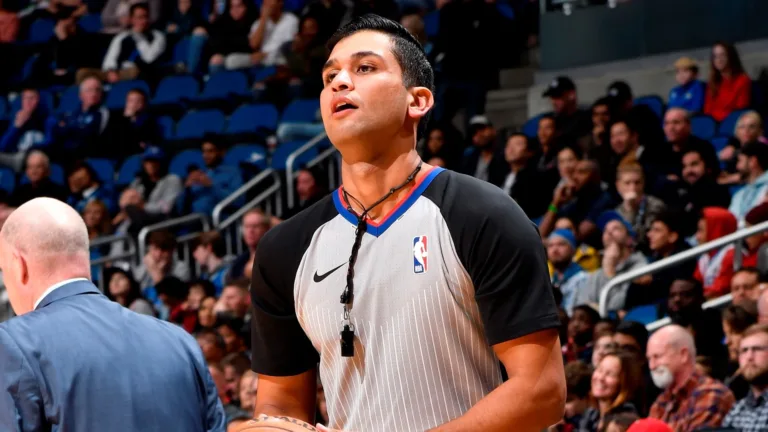 Suyash Mehta officiating during a match.