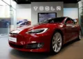 How can Tesla's entry into India affect the Automobile Industry in the country?