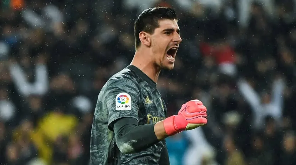 MADRID, SPAIN - MARCH 01: Thibaut Courtois of Real Madrid CF celebrates after his team mate Rodrygo scored his team's second goal during the Liga match between Real Madrid CF and FC Barcelona at Estadio Santiago Bernabeu on March 01, 2020 in Madrid, Spain. (Photo by David Ramos/Getty Images)