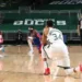 NBA players kneel down during their match.