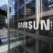 A woman walks past Samsung Electronics Co. signage outside the company's Seocho office building in Seoul, South Korea, on Friday, Feb. 17, 2017. Samsung Group's Jay Y. Lee was formally arrested on allegations of bribery, perjury and embezzlement, an extraordinary step that jeopardizes the executive's ascent to the top role at the world's biggest smartphone maker. Photographer: SeongJoon Cho/Bloomberg via Getty Images