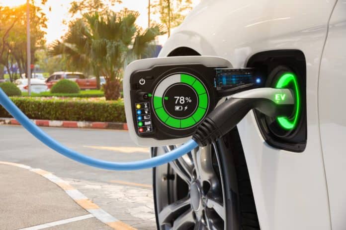 Electric vehicle changing on street parking with graphical user interface, Future EV car concept Israeli start-up innovates ultra-charge battery for EV