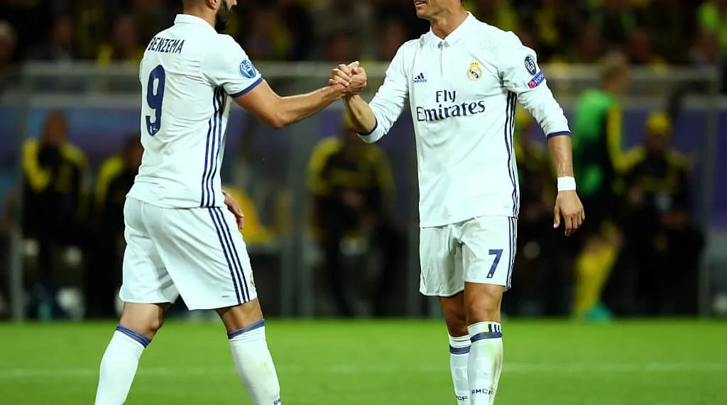 DORTMUND, GERMANY - SEPTEMBER 27:  Karim Benzema and Cristiano Ronaldo of Real Madrid (7) celebrate as Raphael Varane of Real Madrid scores their second goal during the UEFA Champions League Group F match between Borussia Dortmund and Real Madrid CF at Signal Iduna Park on September 27, 2016 in Dortmund, North Rhine-Westphalia.  (Photo by Dean Mouhtaropoulos/Bongarts/Getty Images)
