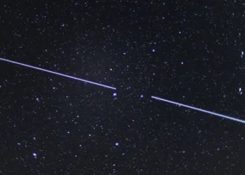 Starlink satellites visible in the night sky in April 2020. Photo by Patrick Pleul / picture alliance via Getty Images