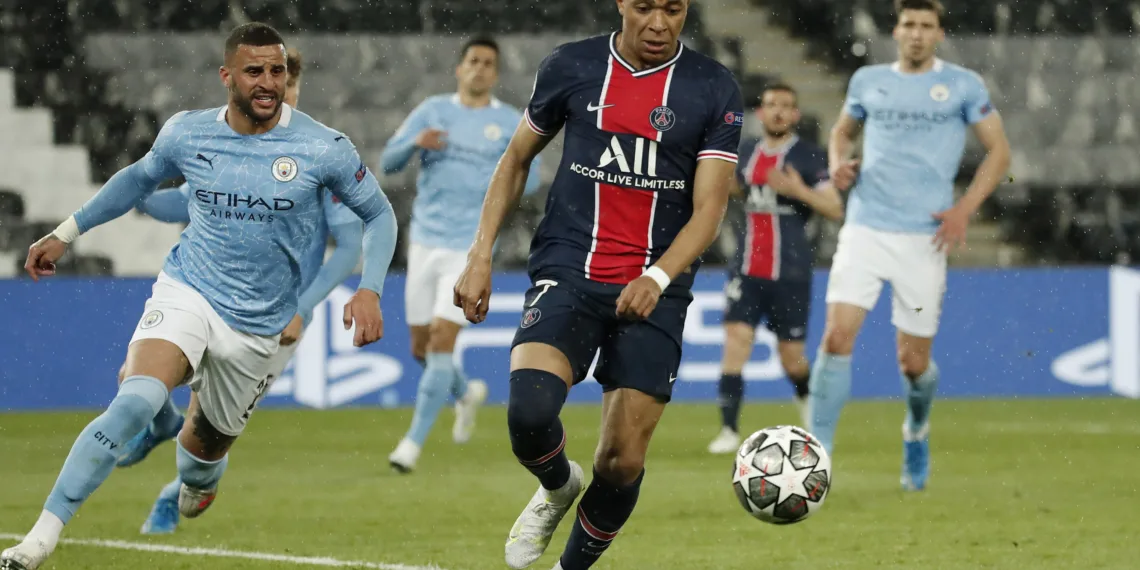 Soccer Football - Champions League - Semi Final First Leg - Paris St Germain v Manchester City - Parc des Princes, Paris, France - April 28, 2021 Paris St Germain's Kylian Mbappe in action as Manchester City's Kyle Walker looks on REUTERS/Benoit Tessier