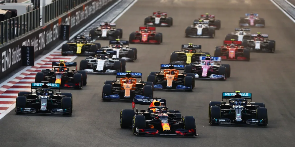 ABU DHABI, UNITED ARAB EMIRATES - DECEMBER 13: Max Verstappen of the Netherlands driving the (33) Aston Martin Red Bull Racing RB16 leads Lewis Hamilton of Great Britain driving the (44) Mercedes AMG Petronas F1 Team Mercedes W11 and Valtteri Bottas of Finland driving the (77) Mercedes AMG Petronas F1 Team Mercedes W11 into turn one at the start during the F1 Grand Prix of Abu Dhabi at Yas Marina Circuit on December 13, 2020 in Abu Dhabi, United Arab Emirates. (Photo by Dan Istitene - Formula 1/Formula 1 via Getty Images)
