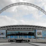 Why does Wembley Stadium host the semi-finals of the FA Cup?