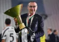 TURIN, ITALY - AUGUST 01: Juventus FC head coach, Maurizio Sarri, celebrates with the trophy after the Serie A match between Juventus and  AS Roma at Allianz Stadium on August 1, 2020 in Turin, Italy.  (Photo by Valerio Pennicino/Getty Images)