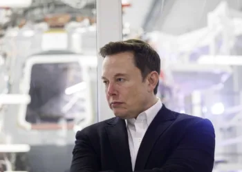 Elon Musk, chief executive officer of Space Exploration Technologies Corp. (SpaceX) and Tesla Inc., listens as Jim Bridenstine, administrator of the U.S. National Aeronautics and Space Administration (NASA), not pictured, speaks during an event at SpaceX headquarters in Hawthorne, California, U.S., on Thursday, Oct. 10, 2019. SpaceXs Elon Musk and NASA Administrator Jim Bridenstine staged a public show of support for one another at the rocket companys headquarters Thursday, weeks after the two traded barbs over the closely held companys delayed efforts to fly astronauts for the first time. Photographer: Patrick T. Fallon/Bloomberg via Getty Images