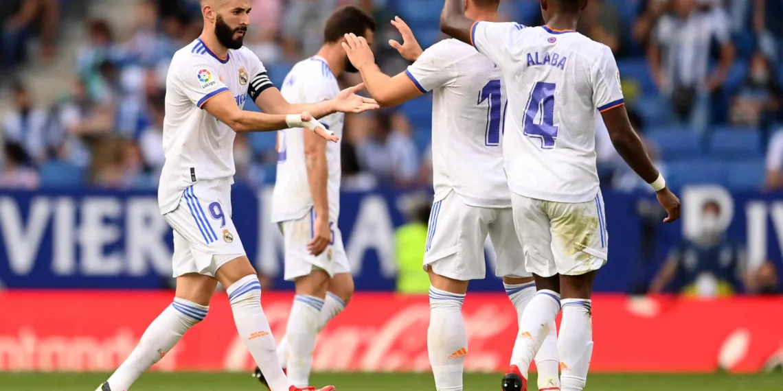 BARCELONA, SPAIN - OCTOBER 03: Karim Benzema of Real Madrid celebrates with teammates after scoring their side's first goal during the La Liga Santander match between RCD Espanyol and Real Madrid CF at RCDE Stadium on October 03, 2021 in Barcelona, Spain. (Photo by David Ramos/Getty Images)