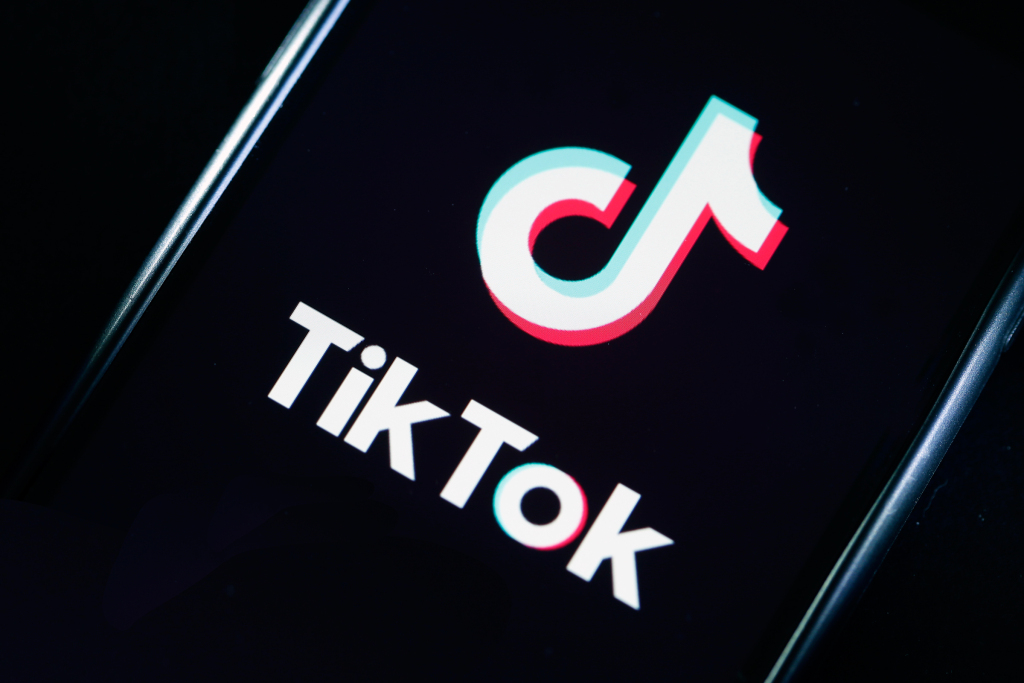 PARIS, FRANCE - MARCH 05: In this photo illustration, the social media application logo, Tik Tok is displayed on the screen of an iPhone on March 05, 2019 in Paris, France. The social network broke the rules for the protection of children's online privacy (COPPA) and was fined $ 5.7 million. The fact TikTok criticized is quite serious in the United States, the platform, which currently has more than 500 million users worldwide, collected data that should not have asked minors. TikTok, also known as Douyin in China, is a media app for creating and sharing short videos. Owned by ByteDance, Tik Tok is a leading  video platform in Asia, United States, and other parts of the world. In 2018, the application gained popularity and became the most downloaded app in the U.S. in October 2018. (Photo by Chesnot/Getty Images)