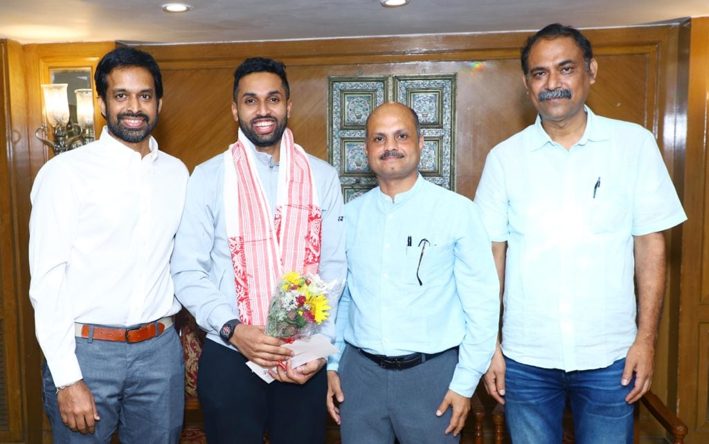 Indias HS Prannoy poses along with chief national coach Pullela Gopichand and BAI General Secretary Sanjay Mishra
