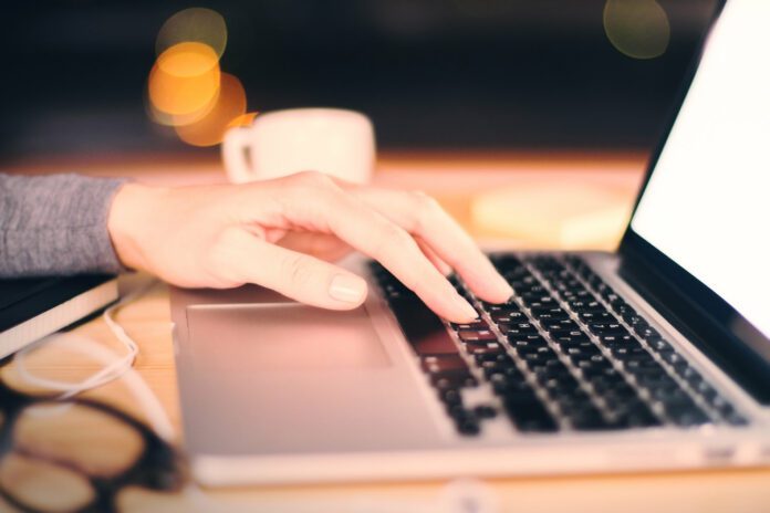 Girl typing in laptop TurboEMDR