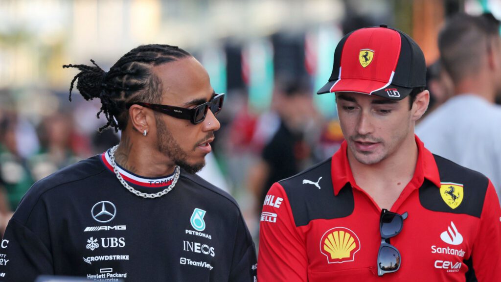 lewis hamilton speaking with charles leclerc planetf1 Lewis Hamilton's tempting offer to sign for Ferrari Discussed