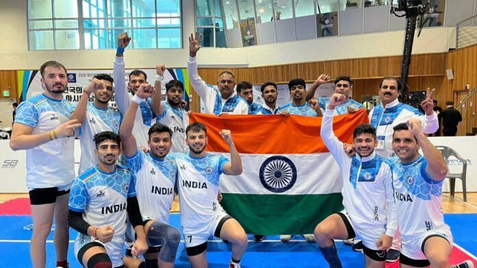 Indian Kabaddi Team via Olympics Indian Kabaddi Team clicking a team picture after winning the Asian Kabaddi Championship 2023