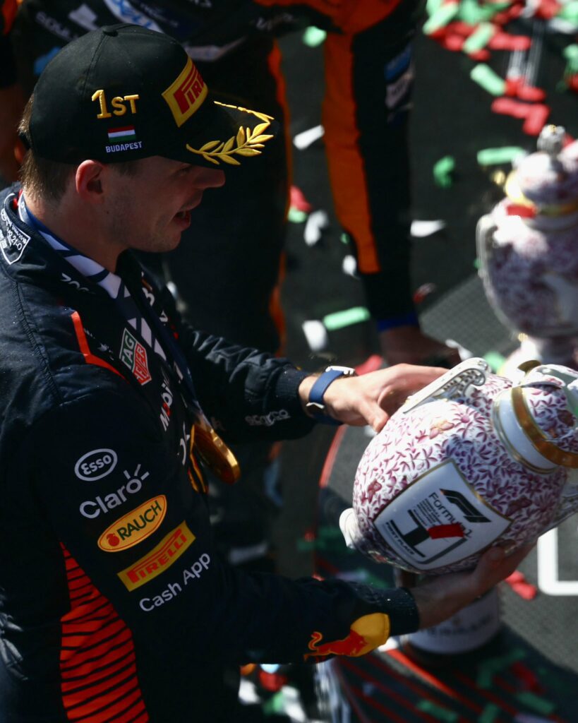 Max Verstappen with the broken trophy via his Official Twitter Verstappen's 7th Consecutive Victory: A Record-Shattering Triumph at the Hungarian Grand Prix 2023