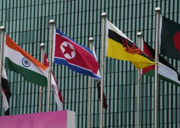 Flags of participating countries, among them North Korea, India, and Brunei, are hoisted at the Athletes Village at the 19th Asian Games in Hangzhou, China, Thursday, Sept. 21, 2023. (AP Photo/Ng Han Guan)